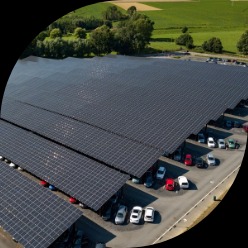 Solar panels surrounded by green fields