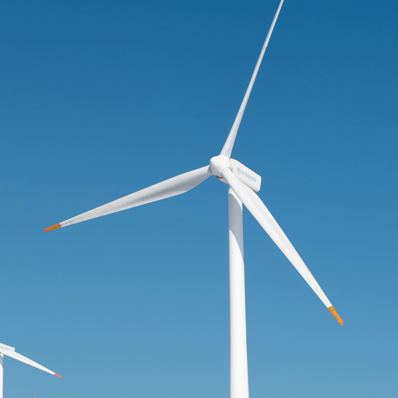 Wind turbine against a clear blue sky